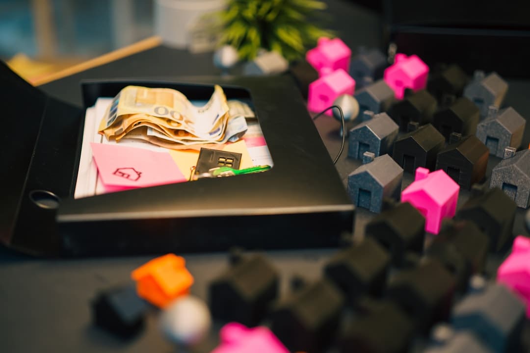 fraud laws — Houses and money represent a financial concept.