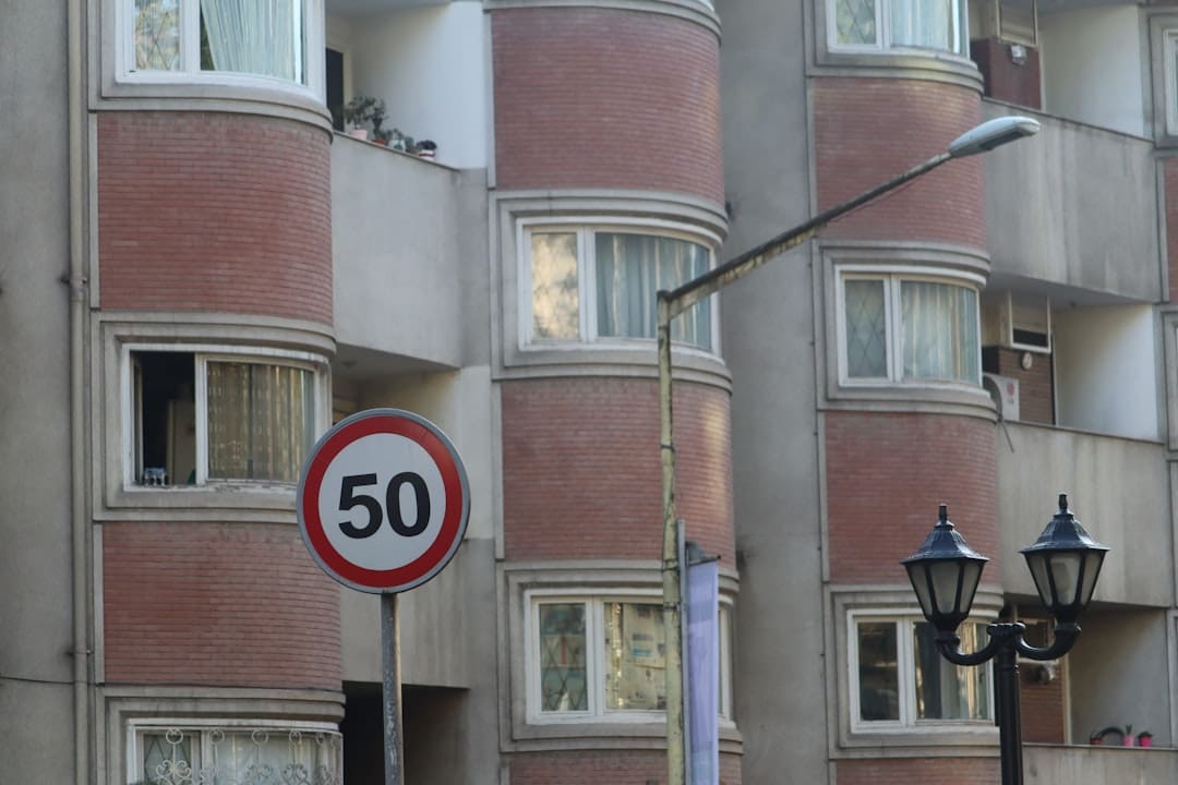 west coast states. A speed limit sign in front of a building.
