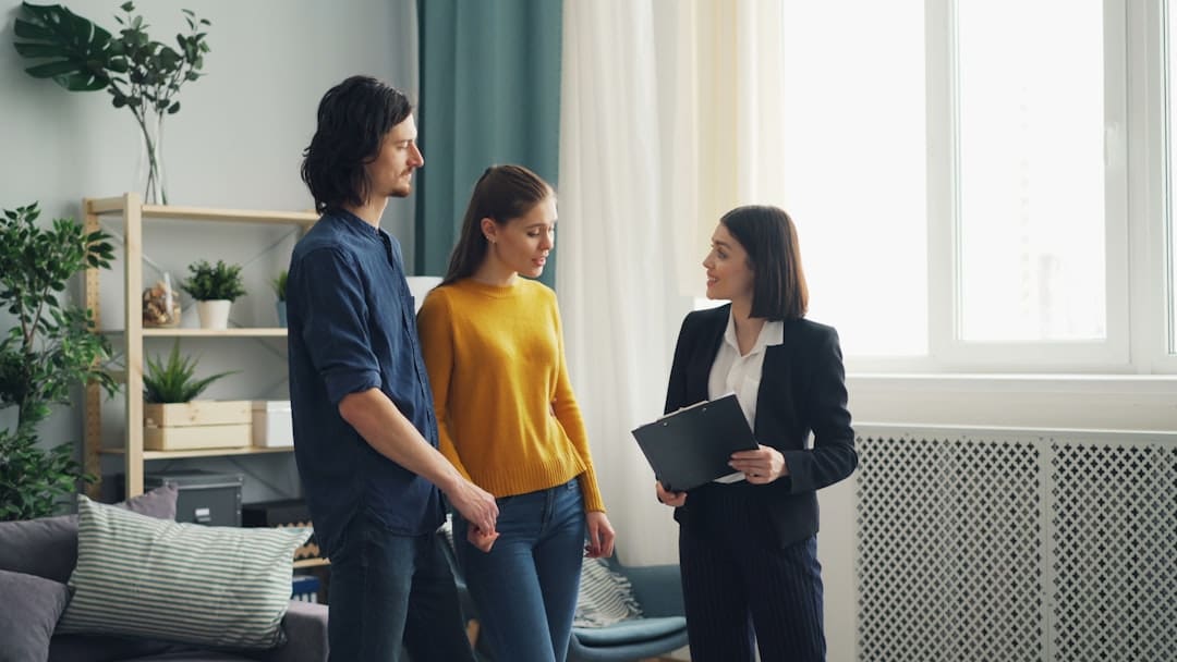 military housing — a group of people standing in a living room