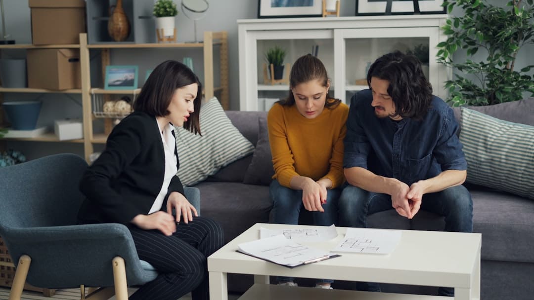 renters insurance support — three people sitting on a couch in a living room