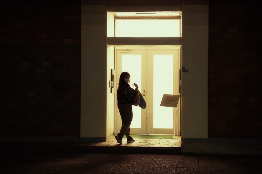 Nevada support animal — a woman standing in front of a door at night