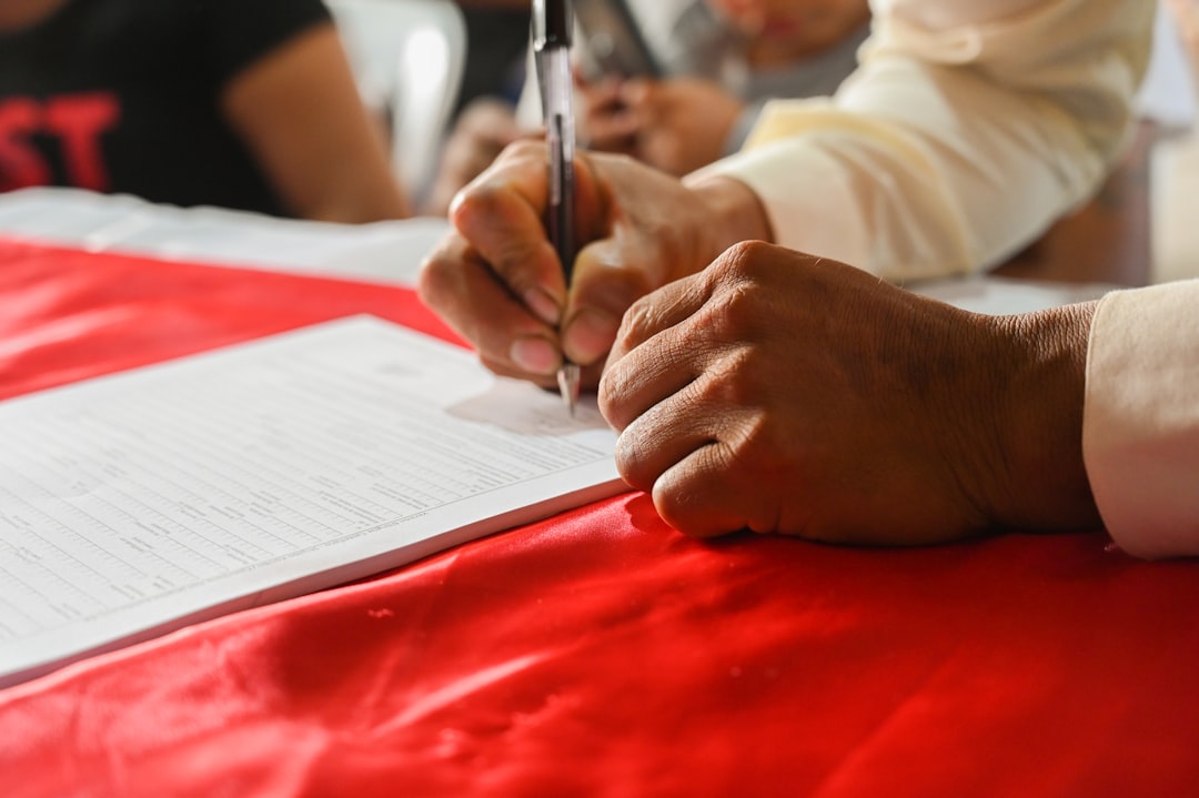georgia support animal — a person writing on a piece of paper