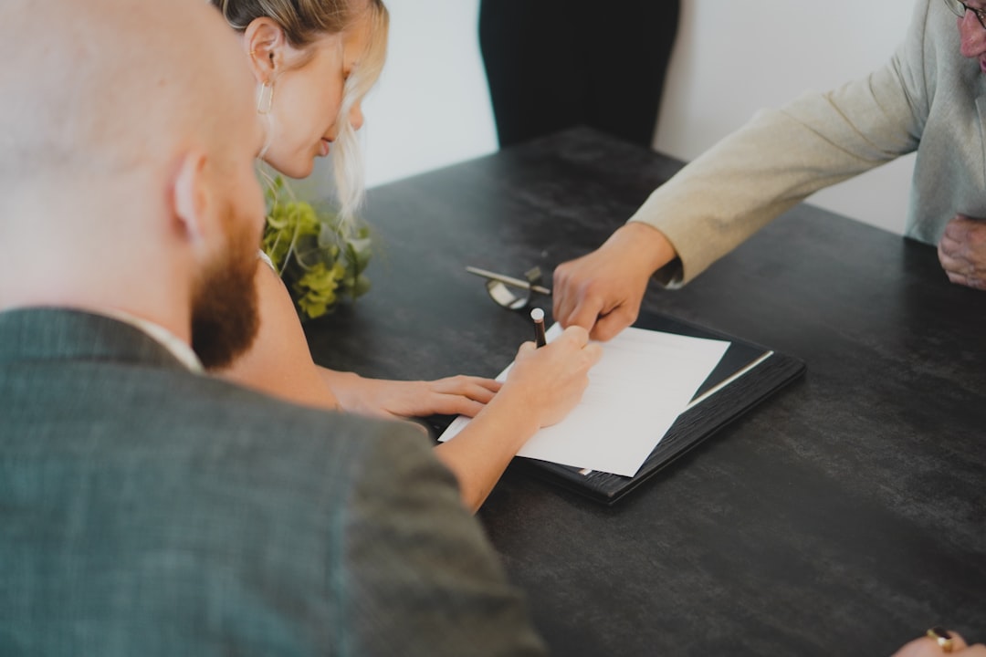 Missouri support animal — couple signing document at desk